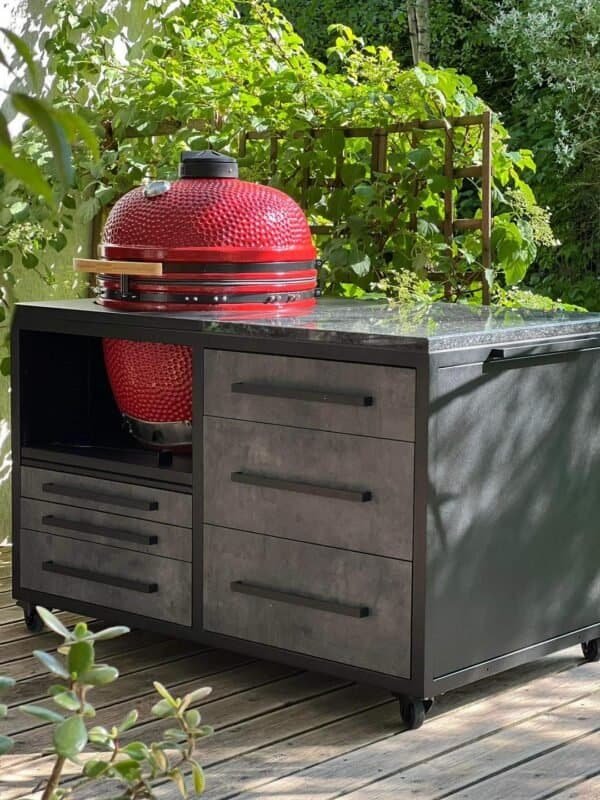 Red Kamado Bono grill in an outdoor kitchen